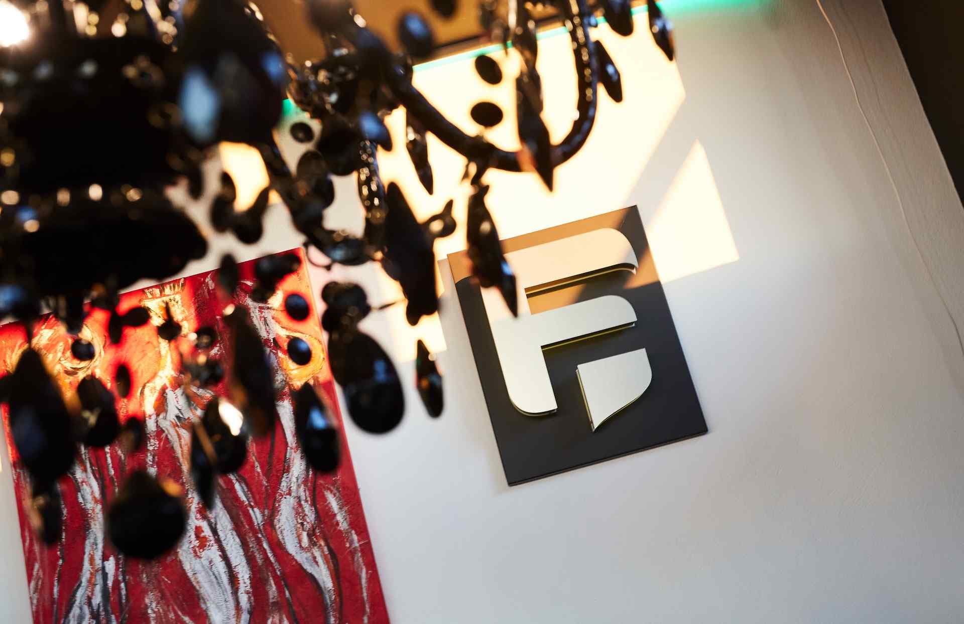 The Autohaus Fontane emblem on the wall inside the showroom